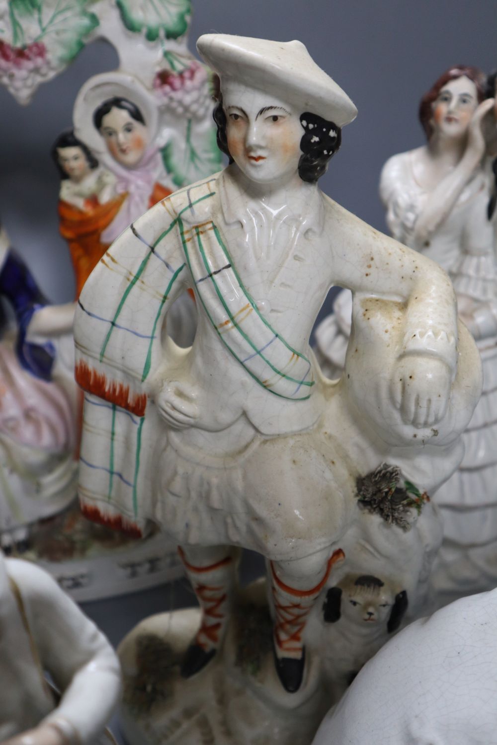 A collection of Staffordshire figures, including a flatback entitled Fortune Teller, height 32cm,